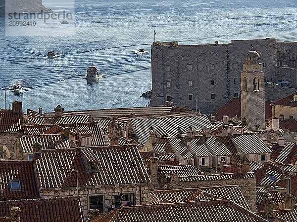 City view with red roofs and clear view of the sea and boats in the background  dubrovnik  Mediterranean Sea  Croatia  Europe