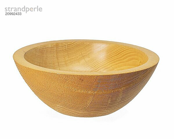 Side view of an empty turned rustic light-coloured wooden bowl set free on white