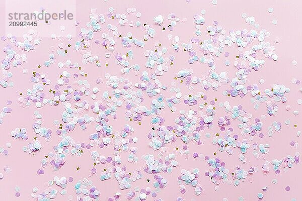 Greeting or invitation card for wedding or birthday with glitter and confetti on pink background.