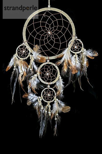 Beaded dreamcatcher with colourful feathers and beads against a black background