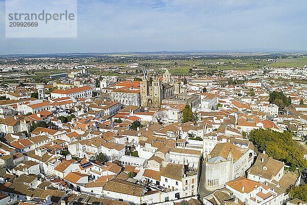 Evora drone aerial view on a sunny day with historic buildings city center and church in Alentejo  Portugal  Europe