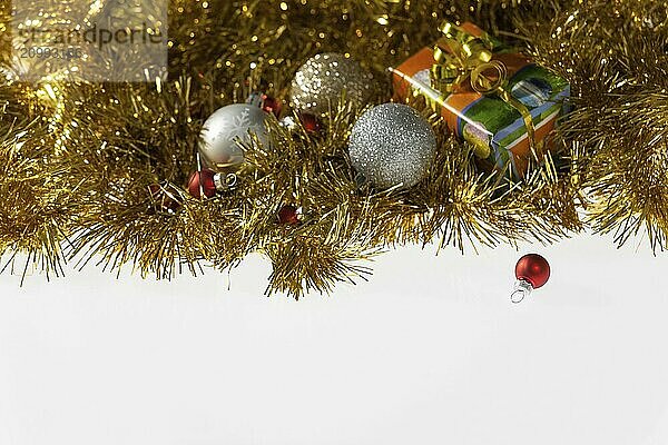 Christmas balls and present on a white background