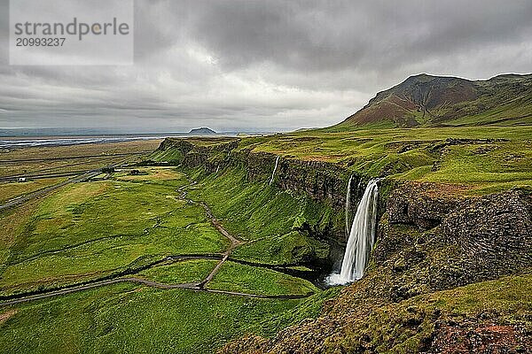 Seljalandsfoss waterfall in a cloudy day seen from above  Iceland  Europe