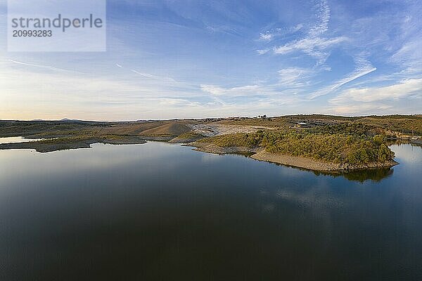 Drone aerial panorama of a dam lake reservoir at sunset in Terena  Portugal  Europe