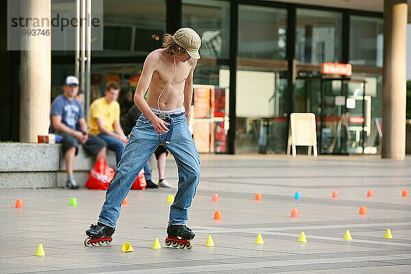 Inline skaters on a parkour in the city centre  Cologne  North Rhine-Westphalia  Germany  Europe