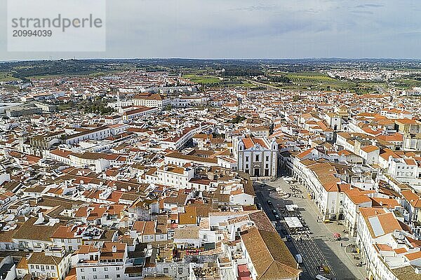 Evora drone aerial view on a sunny day with historic buildings city center and church in Alentejo  Portugal  Europe