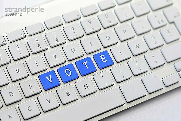 VOTE writing on white keyboard