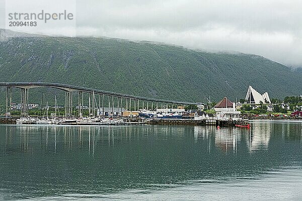 Artic cathedral and bridge in Tromso in a cloudy day  Norway  Europe