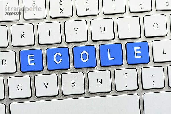 ECOLE writing on white keyboard