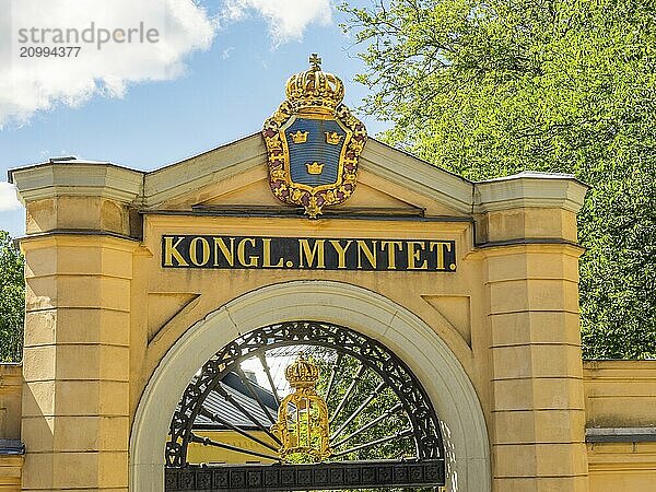 Entrance gate with shield of the Royal Mint and royal emblem  stockholm  baltic sea  sweden  scandinavia