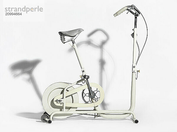 Retro exercise bike isolated on white background