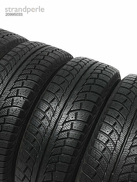 Set of four winter tires isolated on white background