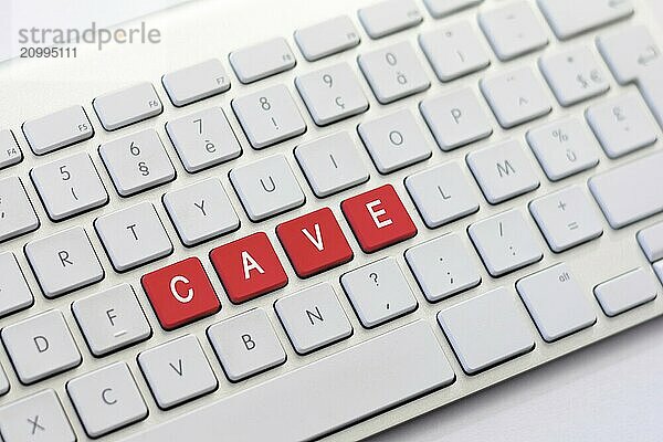 CAVE writing on white keyboard