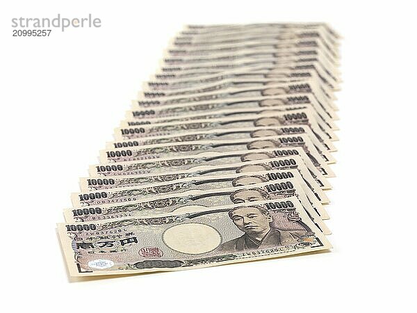 Japanese Yen money bills  closeup of stacked currency isolated on white background