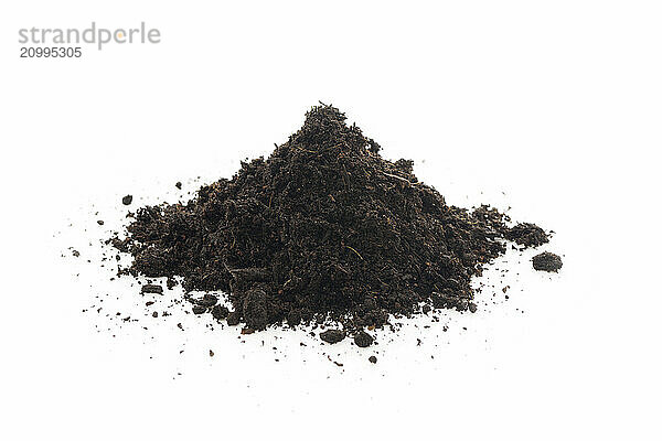 Organic potting soil mix enriched with compost  used in horticulture and gardening. Closeup of an isolated cone pile on white studio background