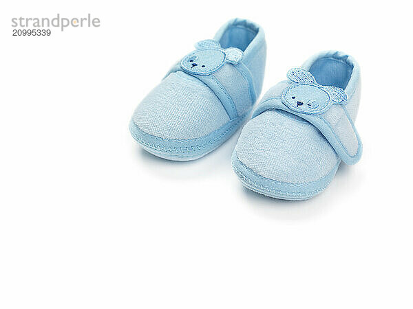 Baby boy blue shoes isolated on white background