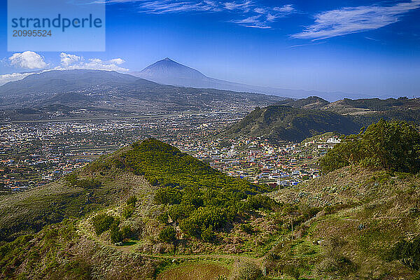 From the Mirador de Jardina in the Anaga Mountains you have a fantastic view of the valley of San Cristóbal de La Laguna and in the background the Pico del Teide with an altitude of 3718m  Tenerife  Canary Islands  Spain  Europe