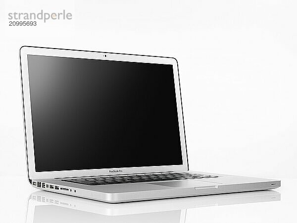 Apple Macbook Pro laptop computer with blank display isolated on white background