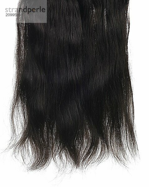 Dark brown hair extensions with real hair isolated texture on white background