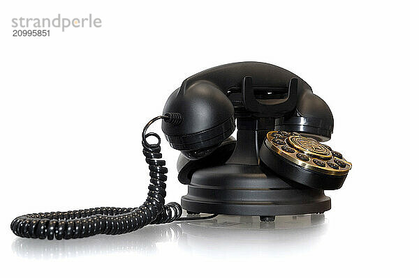 Classic series Paramount collection antique style push-button telephone. Isolated retro object silhouette on white background with a clipping path. Communication history concept