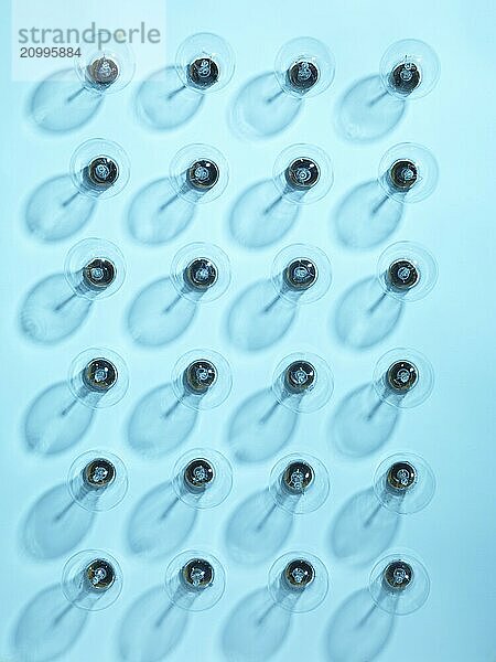 Group of turned off incandescent tungsten light bulbs on blue background