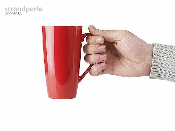 Person holding red tall tea mug in his hand isolated on white background