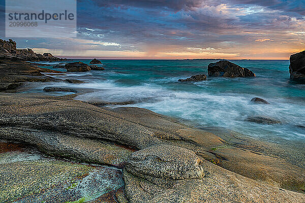 Rocky coast with cloudy sky  sunset  Utakleiv  Lofoten  Norway  Europe