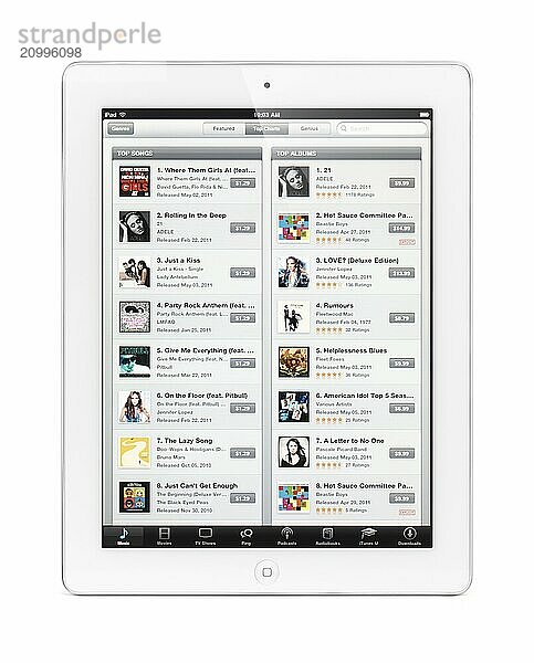 Apple iPad 2 tablet computer with iTunes store on its display. Isolated with clipping path on white background