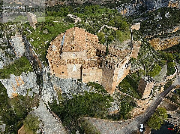 An imposing castle on a cliff with traditional tiled roofs and fortified walls  aerial view  collegiate church on the hill  Colegiata de Santa María la Mayor  Alquézar  Alquezar  Huesca  Aragón  Aragon  Pyrenees  Spain  Europe