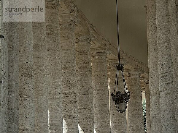 Atmospheric view of columns and lanterns in classical style in the interior of the Vatican  Rome  Italy  Europe