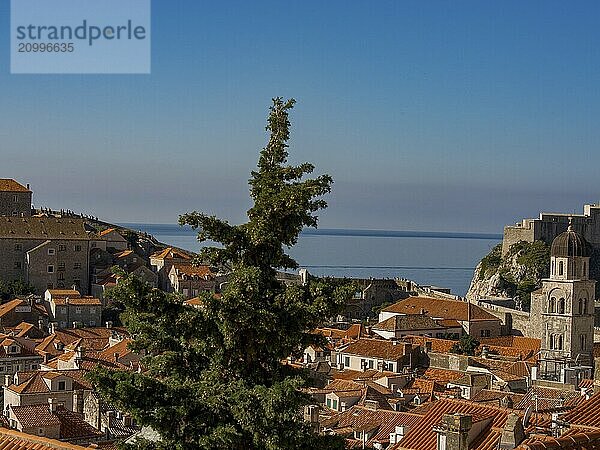 View over a city with tiled roofs and church towers to the coastal landscape  dubrovnik  Mediterranean Sea  Croatia  Europe