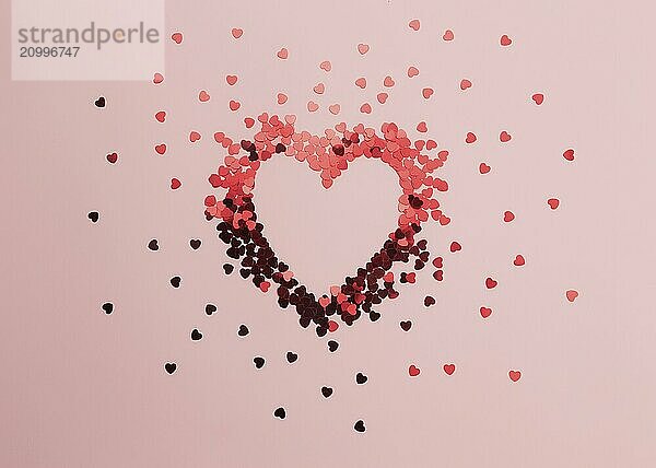 Red heart glitters on the pink background.