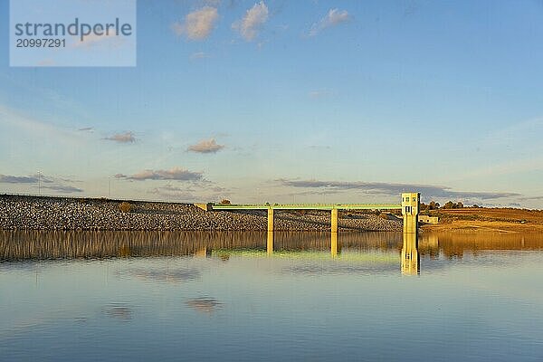 Lake reservoir dam landscape view at sunset during autumn fall in Sabugal Dam  Portugal  Europe