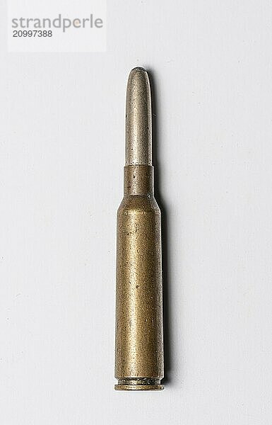 Old rifle bullet from the 1950s on white background