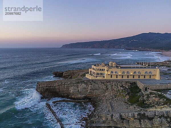 Aerial drone photo of Praia do Guincho Beach and Hotel Fortaleza at sunset in Sintra  Portugal  Europe