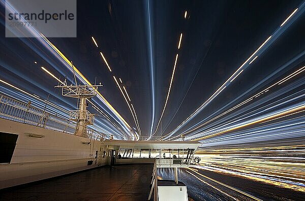 Gothenburg  Sweden  April 24 2011: Long exposure image of a ferry passing under a bridge  Europe