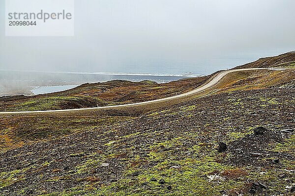 Mountains and ocean view in Borgarfjordur Eystri in east Iceland in a foggy day