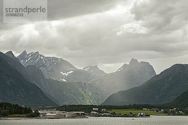 Andalsnes and mountains along the Romsdalsfjorden under a cloudy sky  Norway  Europe