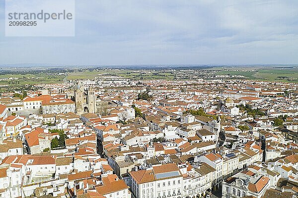 Evora drone aerial view on a sunny day with historic buildings city center and church in Alentejo  Portugal  Europe