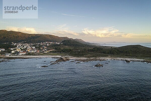 Amazing drone aerial landscape view of mountains in atlantic ocean with waves at sunset in Caldebarcos in Galiza  Spain  Europe