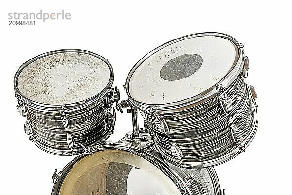 Three drums of an old drum kit  cut out on white