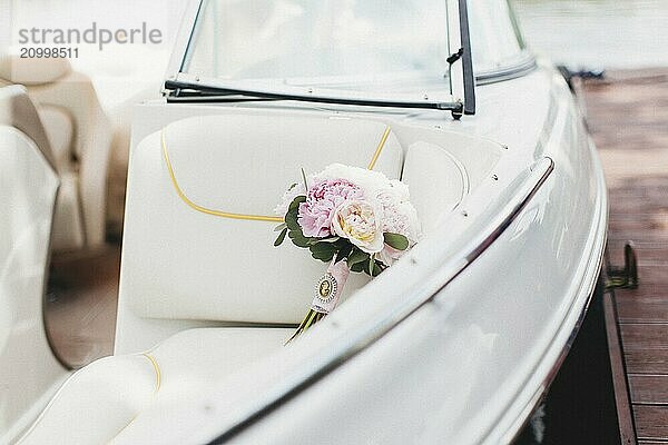 Luxury wedding bouquet in the white boat.