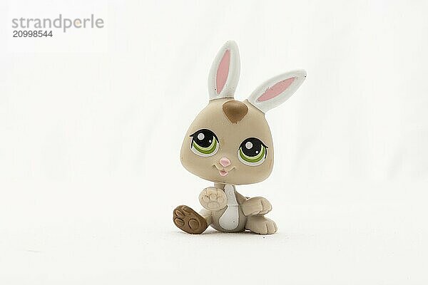 Plastic toy rabbit on white background