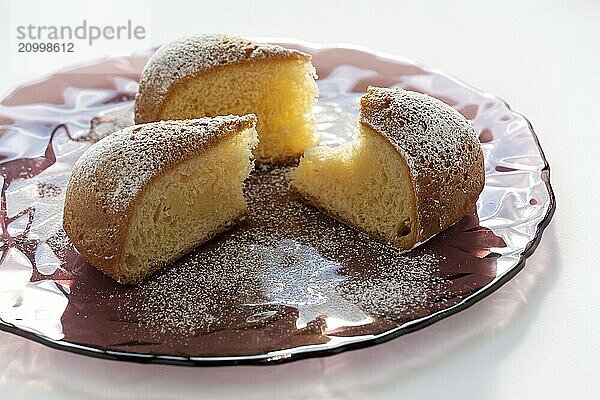 Slices of cake over a plate on a white background