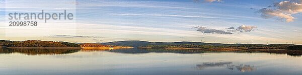 Panorama of a lake reservoir dam landscape view at sunset during autumn fall in Sabugal Dam  Portugal  Europe