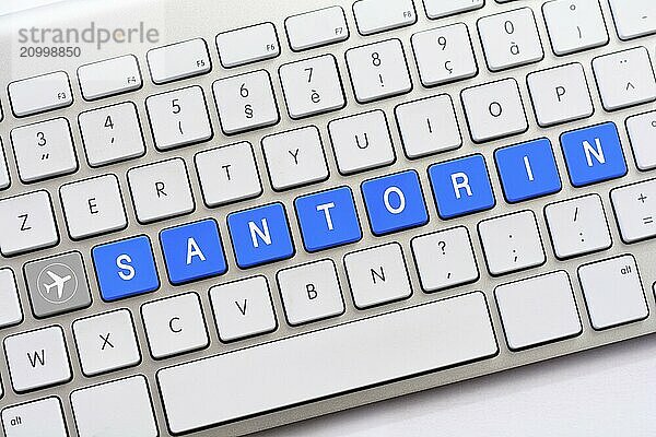 SANTORIN writing on white keyboard with a aircraft sketch