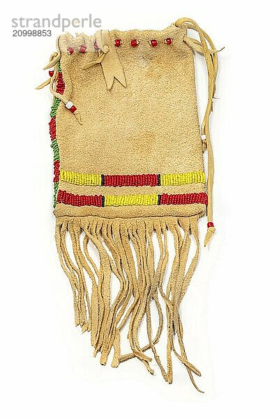 Bag of the North American Indians. Made from deerskin embroidered with colourful glass beads and leather cords on a white background