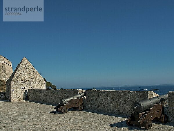 Old fortifications with cannons and sea views under a blue sky  ibiza  mediterranean sea  spain