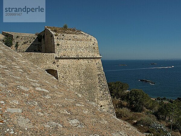 Historic fortress on the coast with sweeping views over the blue sea and small islands  ibiza  mediterranean sea  spain