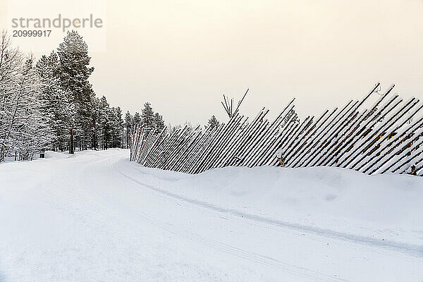 Snowy catch fence  Ivalo  Finland  Scandinavia  Europe